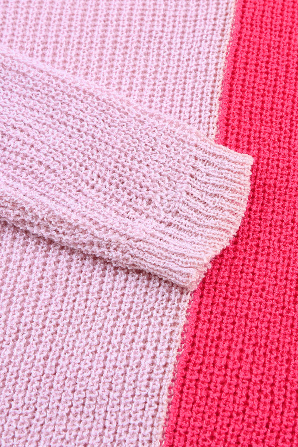 Pull rose à manches longues et col en V colorblock