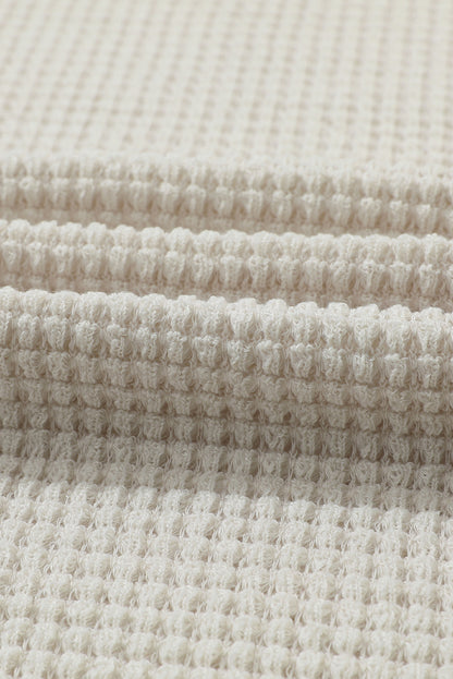 Haut en maille gaufrée beige à manches bouffantes et imprimé tournesol 