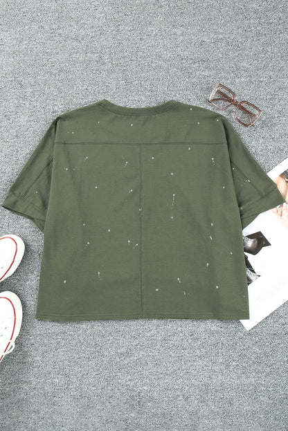 Haut à manches courtes et ourlet asymétrique délavé et vieilli