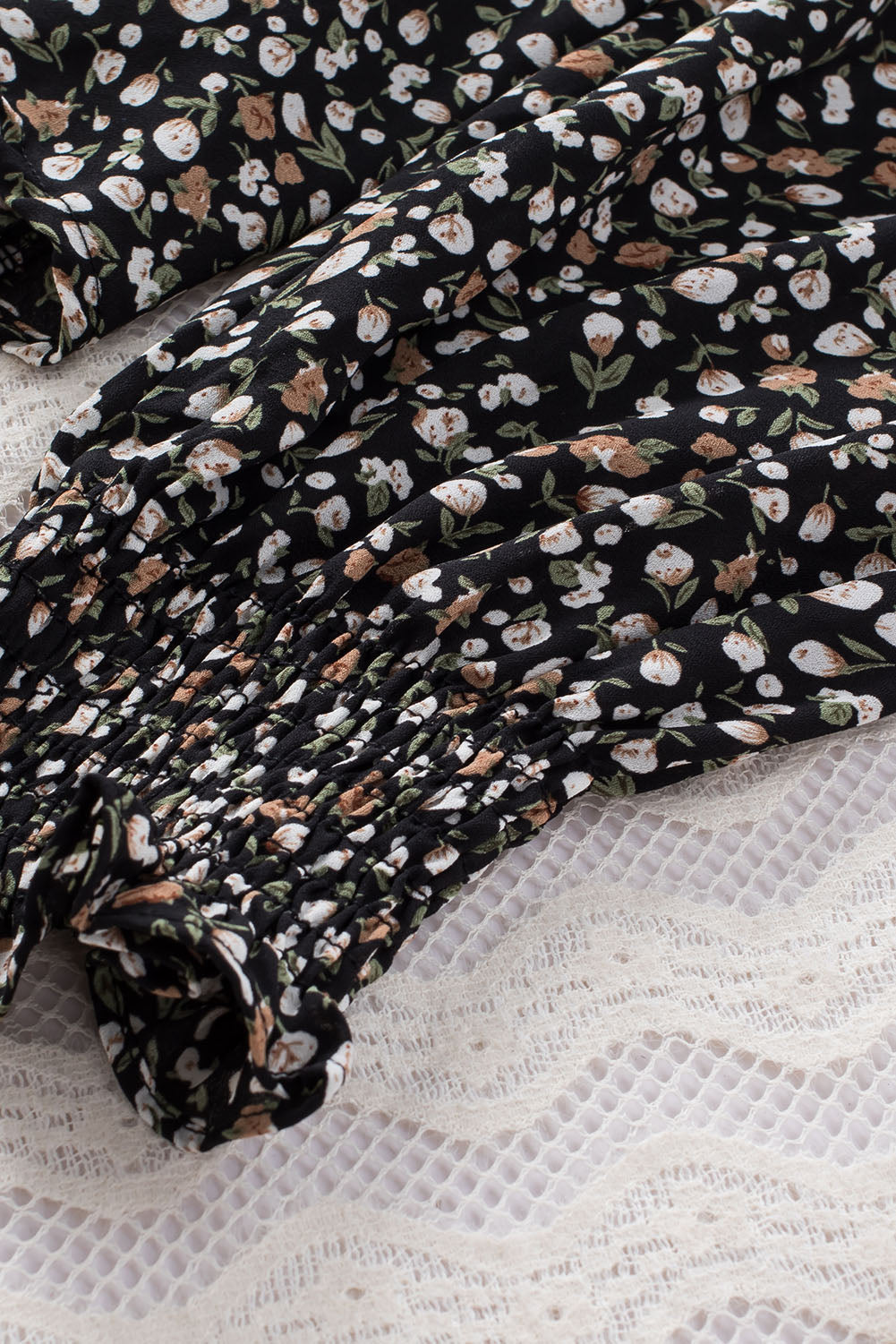 Blusa de manga larga con volantes y lazo delantero con estampado floral