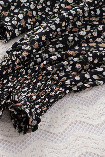 Blusa de manga larga con volantes y lazo delantero con estampado floral