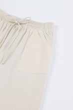 Pantalones de punto con bolsillos y cintura con cordón 