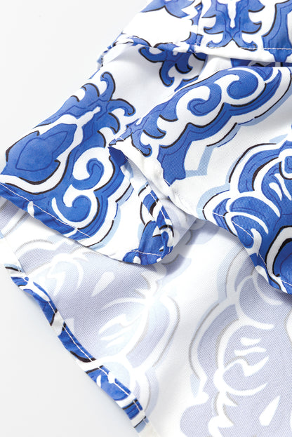 Robe Ashleigh bleue à imprimé floral vintage et manches larges à volants