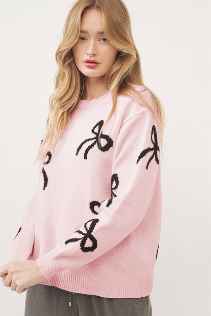 Pull ample en maille rose clair à motif nœud