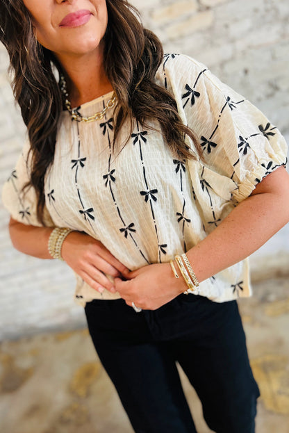 Haut à manches courtes bouffantes et imprimé nœud beige