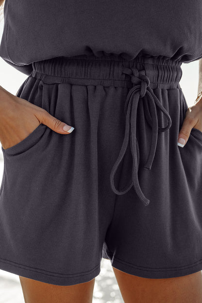 Combinaison Bristol noire en tricot à dos ouvert et manches courtes avec cordon de serrage