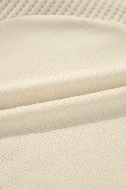 Haut beige à manches longues en tricot thermique avec coutures apparentes