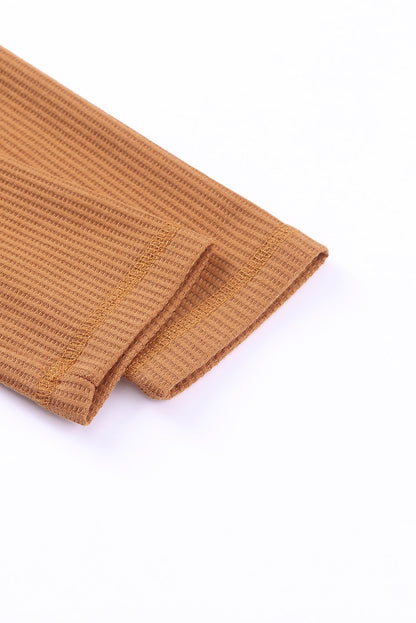 Top henley de punto gofre con medio botón 