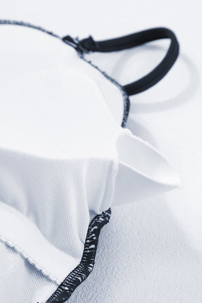 Maillot de bain une pièce bleu marine côtelé avec cordon de serrage et découpes sur les côtés