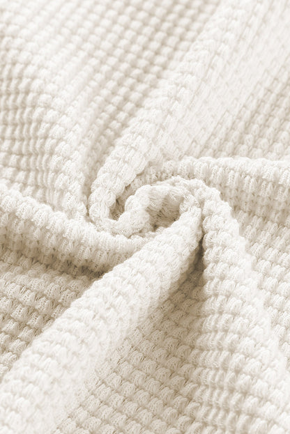 Haut ample en tricot gaufré à col fendu et poches