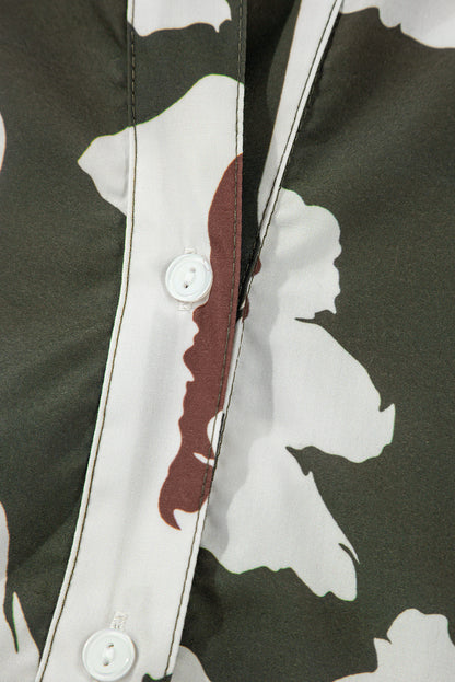 Chemisier à manches bouffantes et demi-bouton à imprimé floral abstrait trèfle à quatre feuilles