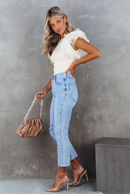 Haut en maille côtelée à volants et manches en maille à pois