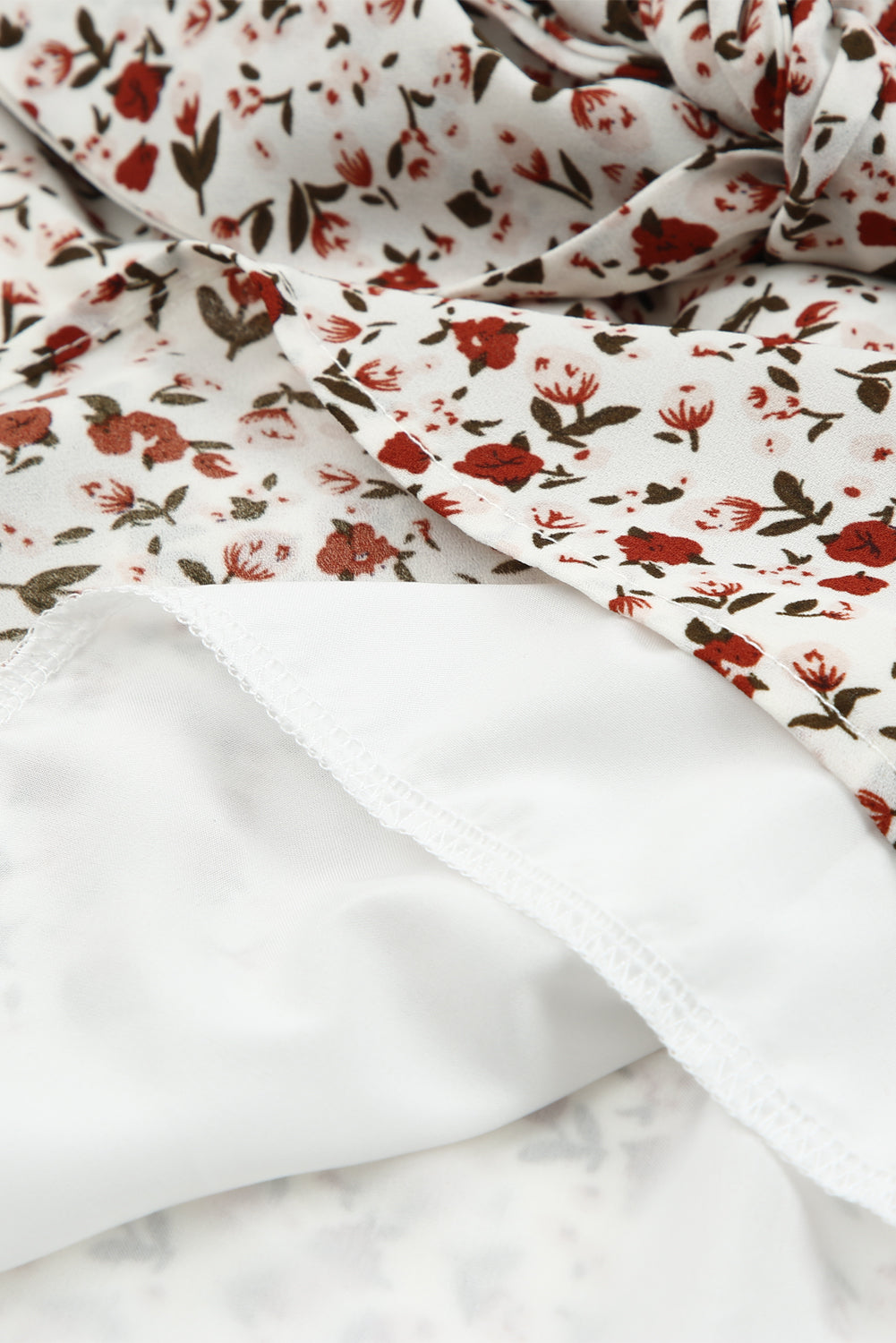 Blusa de manga larga con volantes y lazo delantero con estampado floral