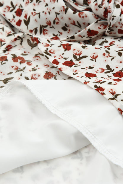 Blusa de manga larga con volantes y lazo delantero con estampado floral