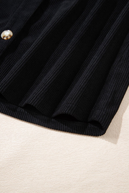 Veste-chemise noire en velours côtelé avec capuche et poches à cordon