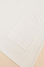 Top tipo túnica de manga corta con bolsillos laterales blancos