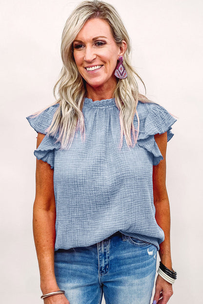 Chemisier texturé à manches flottantes et col à volants 