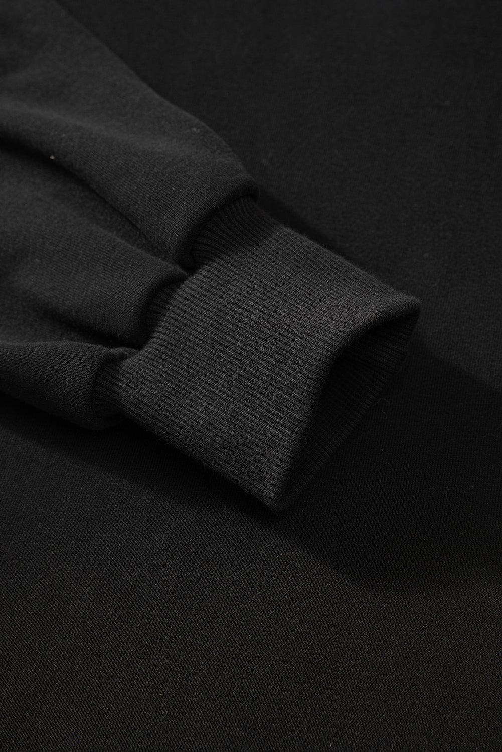 Sweat-shirt noir uni à col rond et ourlet haut-bas