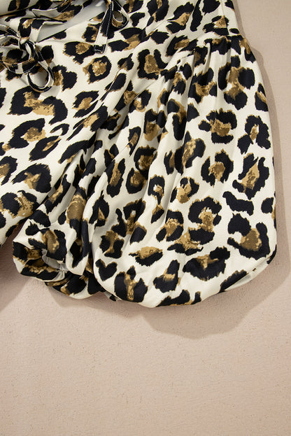 Chemisier péplum à manches bouffantes et nœud papillon sur le devant, motif léopard abricot