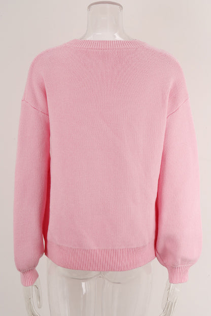 Pull col rond à épaules tombantes et nœud rose