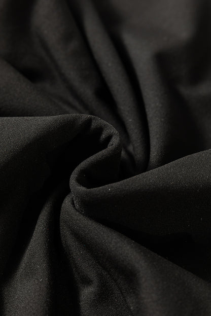 Haut thermique noir uni à col rond et coupe slim