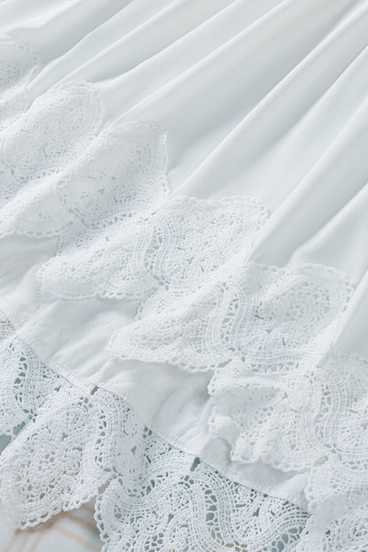 Chemisier à manches cloche et empiècements en crochet