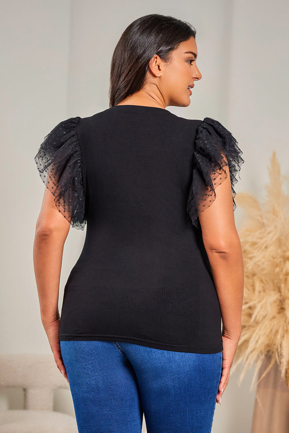 Haut en maille côtelée à volants et manches en maille à pois