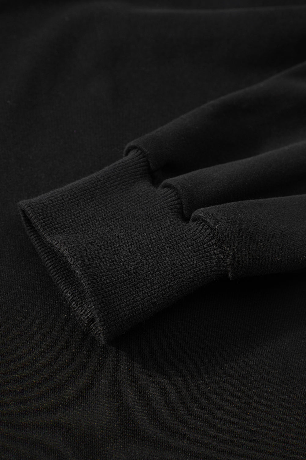 Sweat-shirt noir uni à col rond et ourlet haut-bas