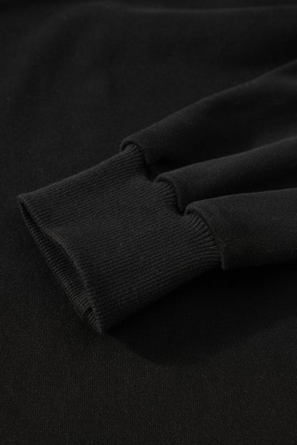 Sweat-shirt noir uni à col rond et ourlet haut-bas