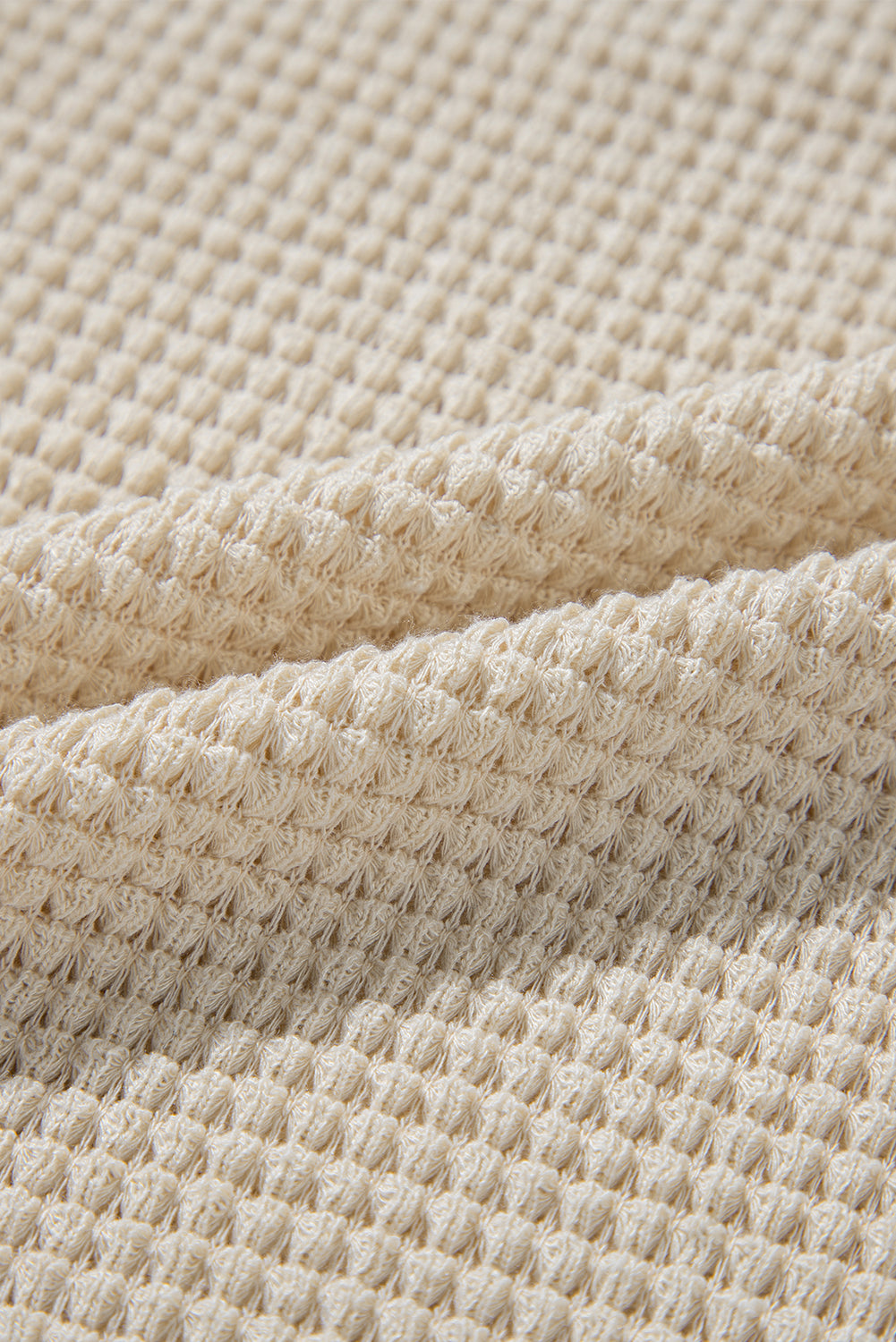 Chemisier péplum beige à imprimé floral gaufré et manches courtes à volants