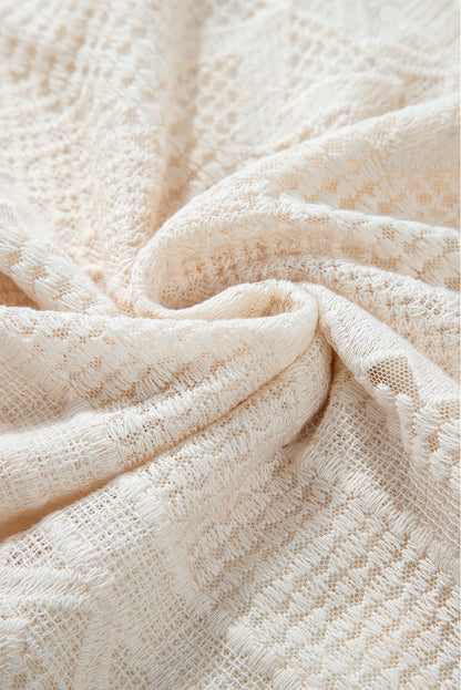 Chemisier blanc à manches longues et boutons en dentelle géométrique