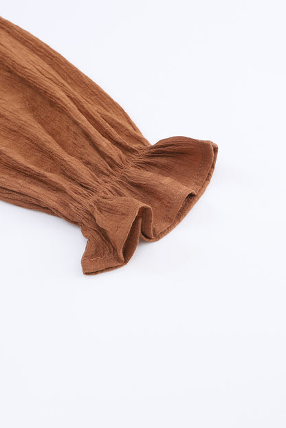 Mini-robe noire à volants et manches évasées 