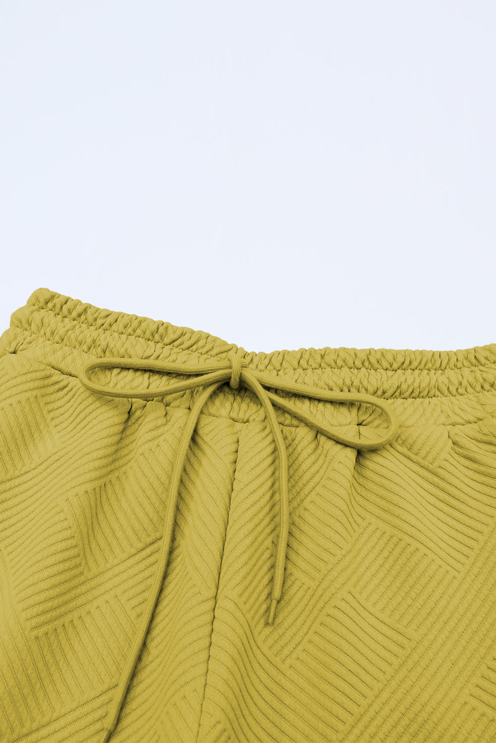 Conjunto de camiseta holgada con textura gris y pantalón con cordón