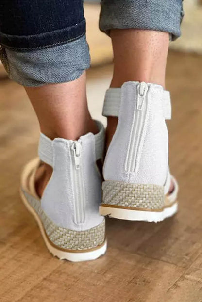 Sandalias de cuña baja con cremallera y tiras cruzadas en beige