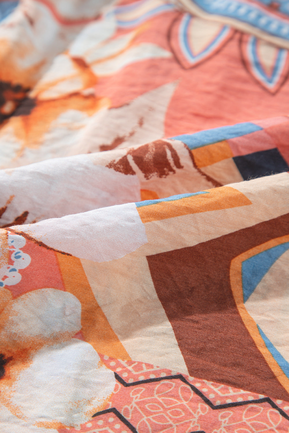 Chemise ample boutonnée à imprimé floral orange et poignets froncés