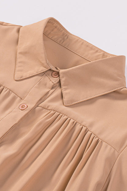 Chemisier boutonné à manches bouffantes de couleur unie