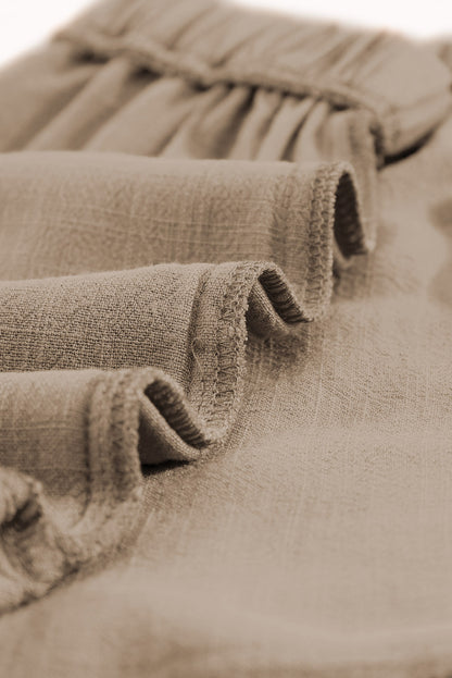 Short kaki taille haute à volants et poches