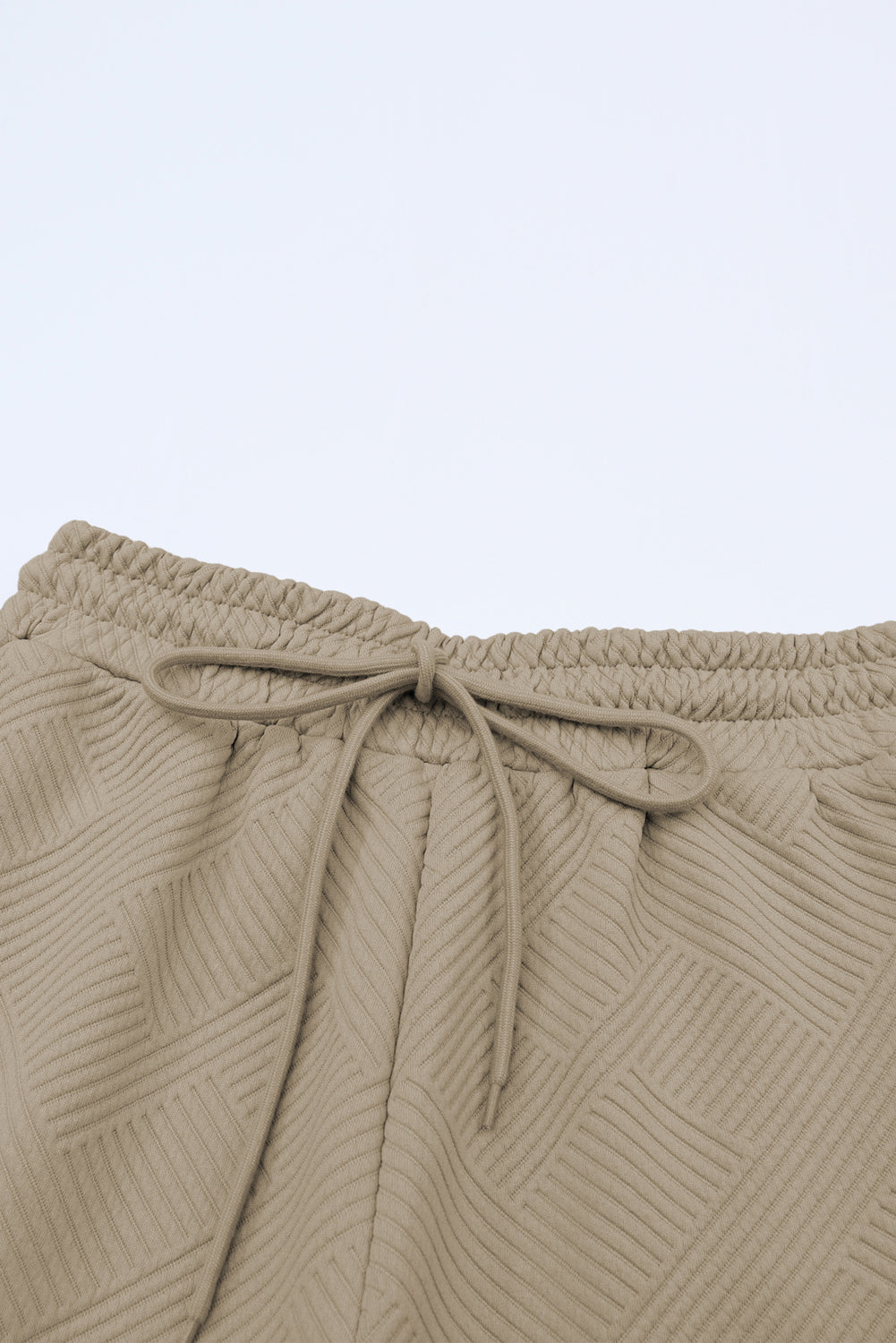 Conjunto de camiseta holgada con textura gris y pantalón con cordón