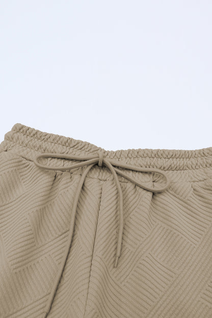 Conjunto de camiseta holgada con textura gris y pantalón con cordón