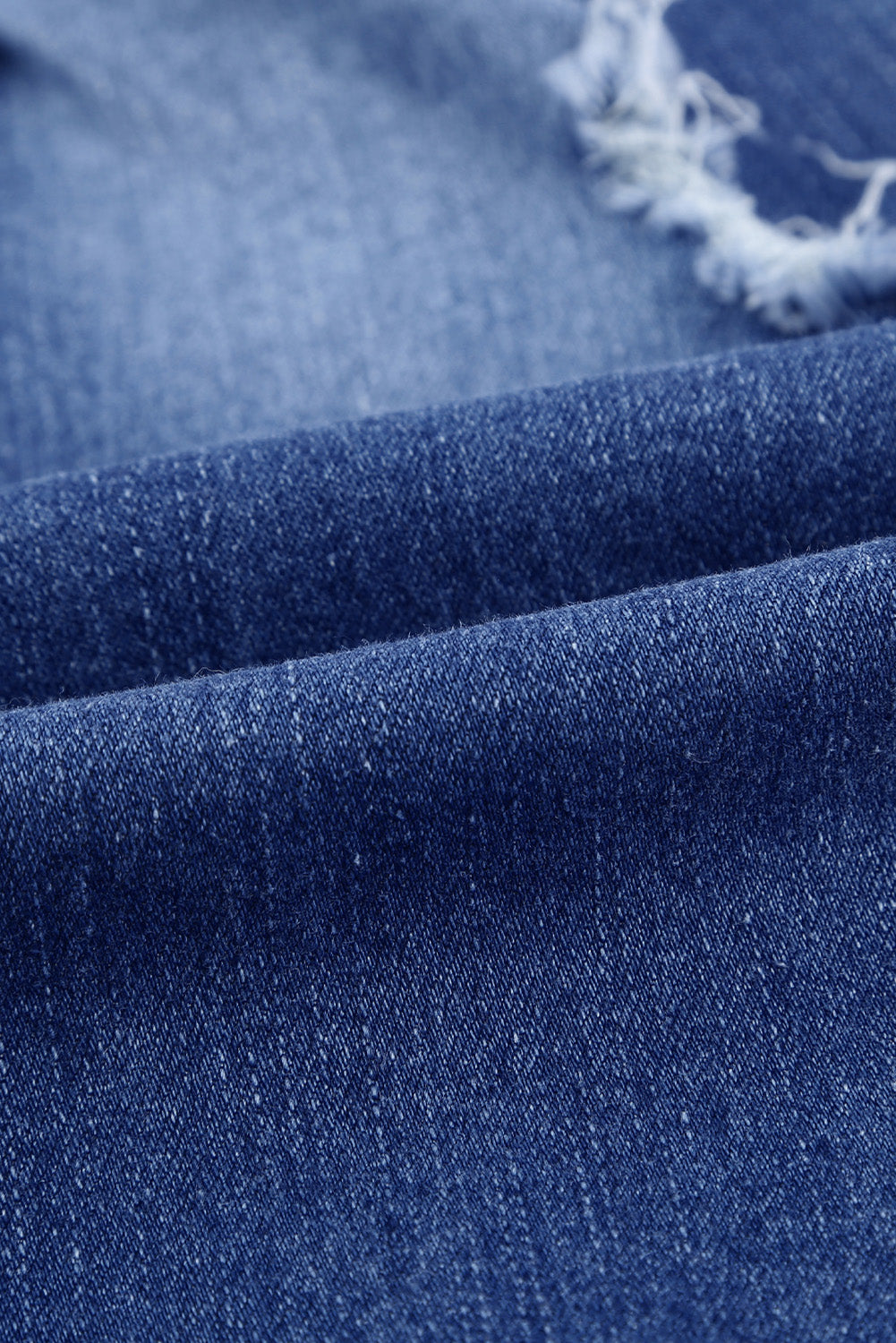 Joggers de mezclilla desgastados con bolsillos