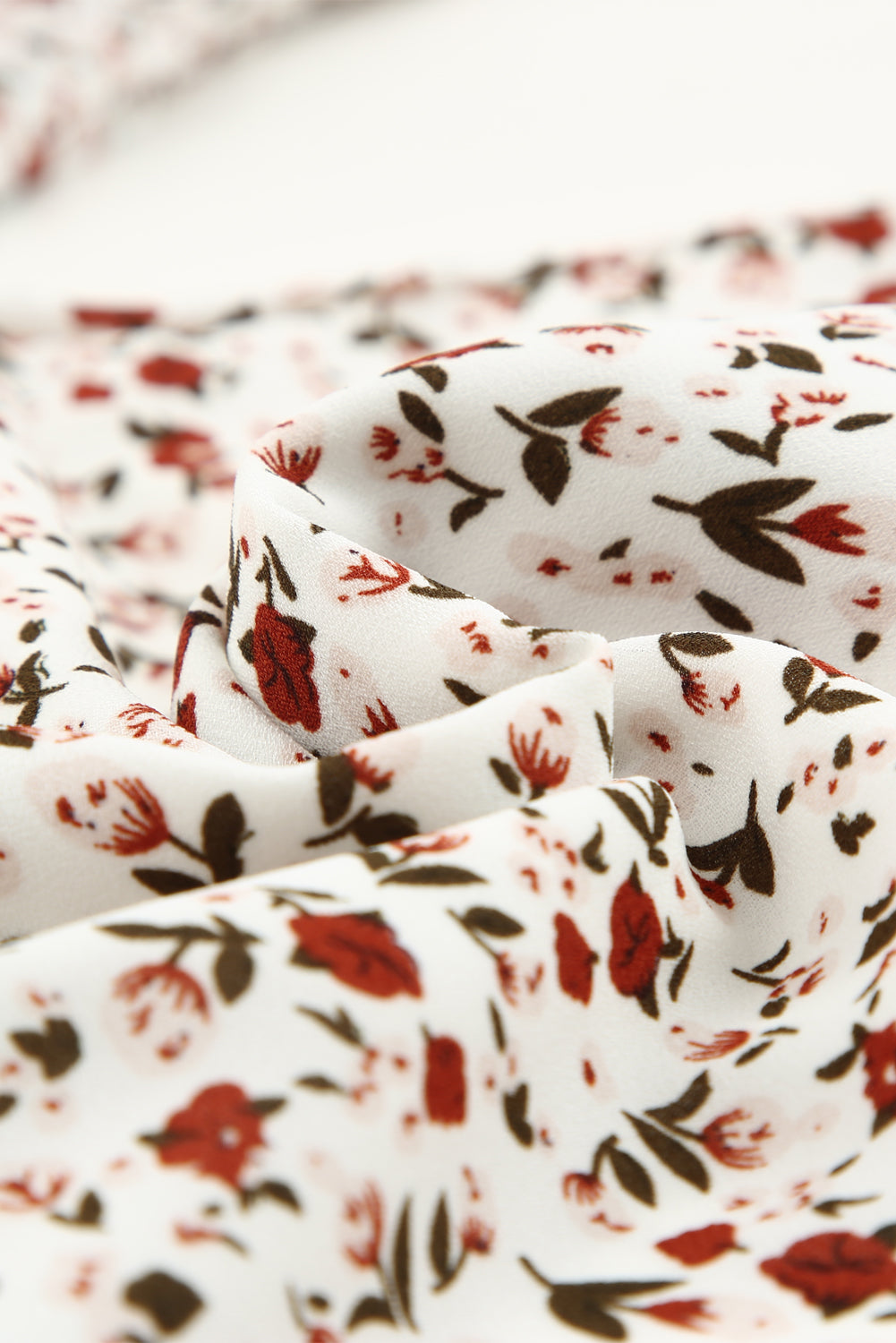 Blusa de manga larga con volantes y lazo delantero con estampado floral