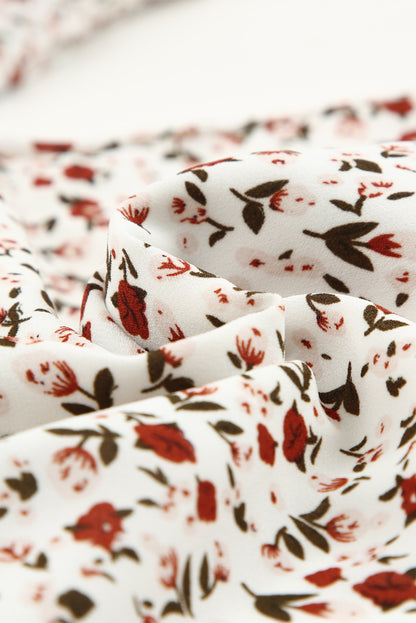 Blusa de manga larga con volantes y lazo delantero con estampado floral