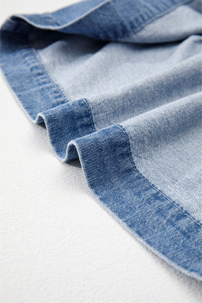 Chemise en jean péplum bleu crépuscule à manches bouffantes et nouée sur le devant