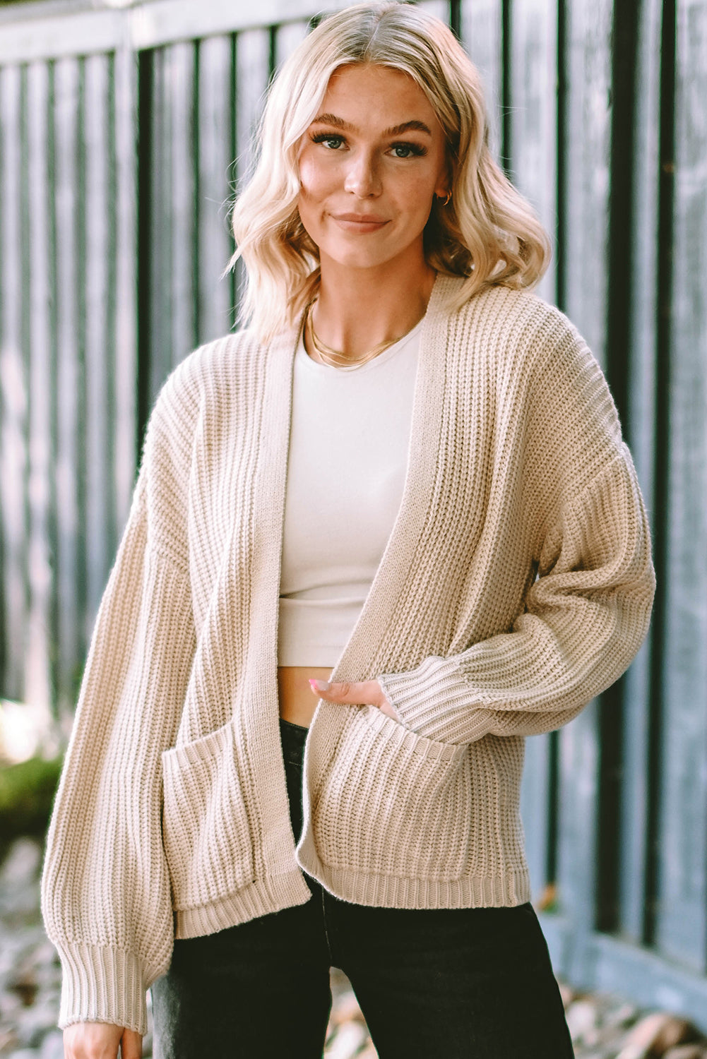 Cardigan court ouvert à poches rose uni 