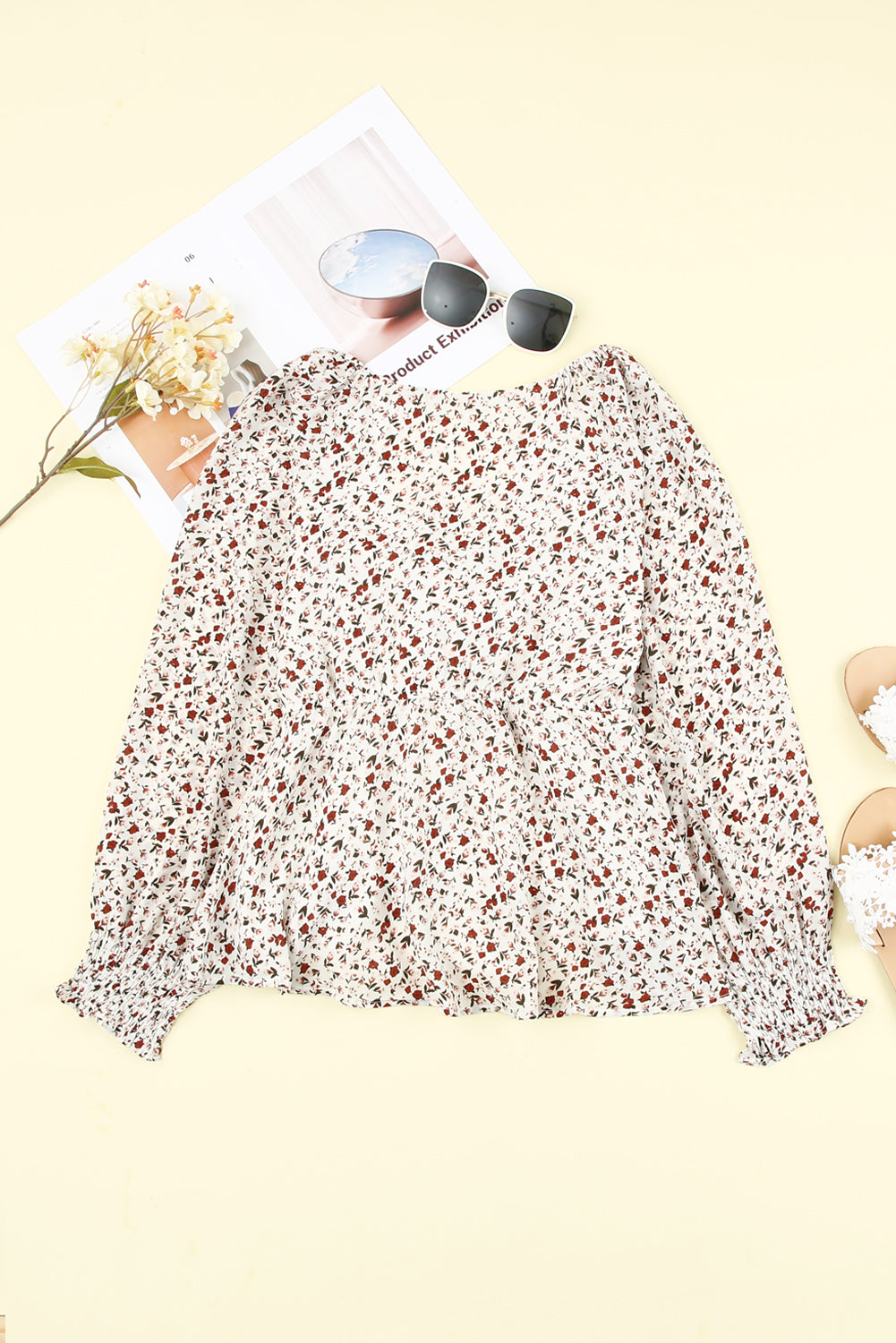 Blusa de manga larga con volantes y lazo delantero con estampado floral