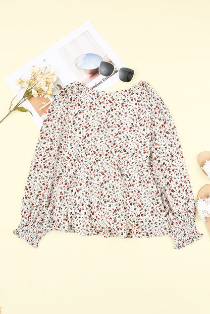 Blusa de manga larga con volantes y lazo delantero con estampado floral