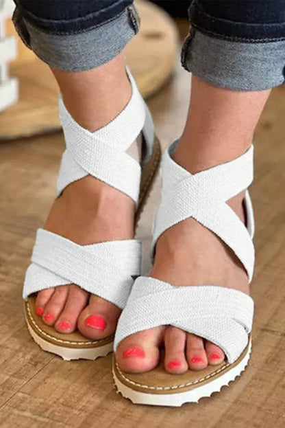 Sandalias de cuña baja con cremallera y tiras cruzadas en beige