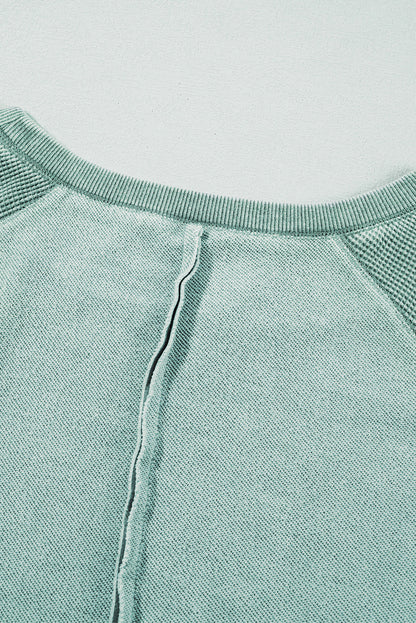 Sweat-shirt raglan bleu minéral en maille gaufrée à coutures apparentes