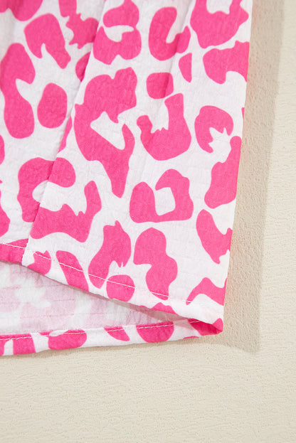 Mini-robe boutonnée à manches longues et imprimé léopard rose vif