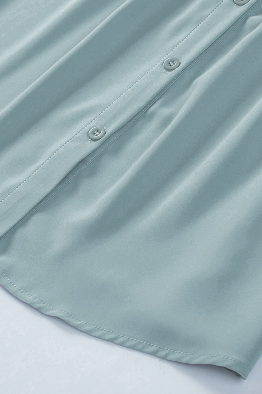 Chemisier boutonné à manches bouffantes de couleur unie